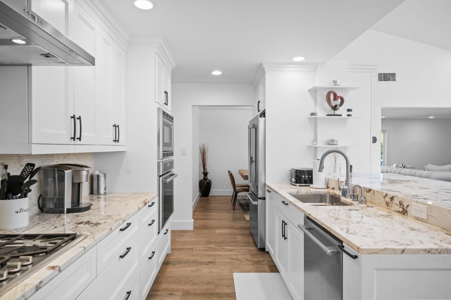 575 Darrell Road Hillsborough, CA 94010 - Photo 25 of 75 a large kitchen with cabinets a sink a stove and refrigerator