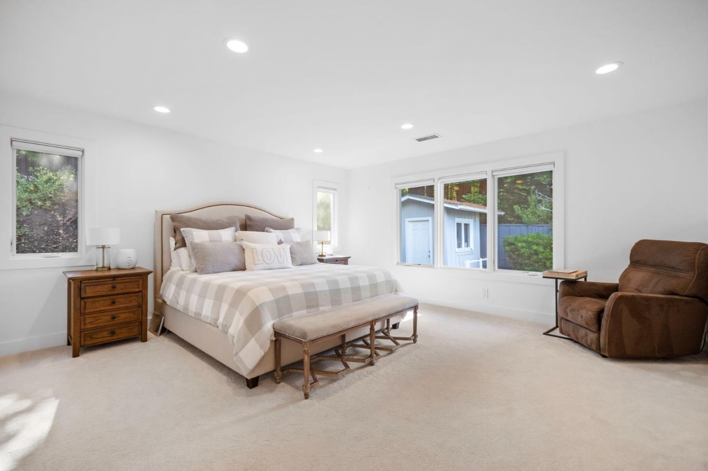 575 Darrell Road Hillsborough, CA 94010 - Photo 32 of 75 a spacious bedroom with a bed and a couch