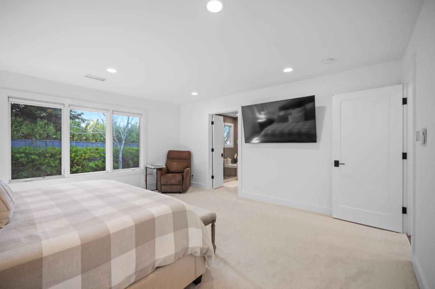 575 Darrell Road Hillsborough, CA 94010 - Photo 33 of 75 a bed room with a bed a television and a large window