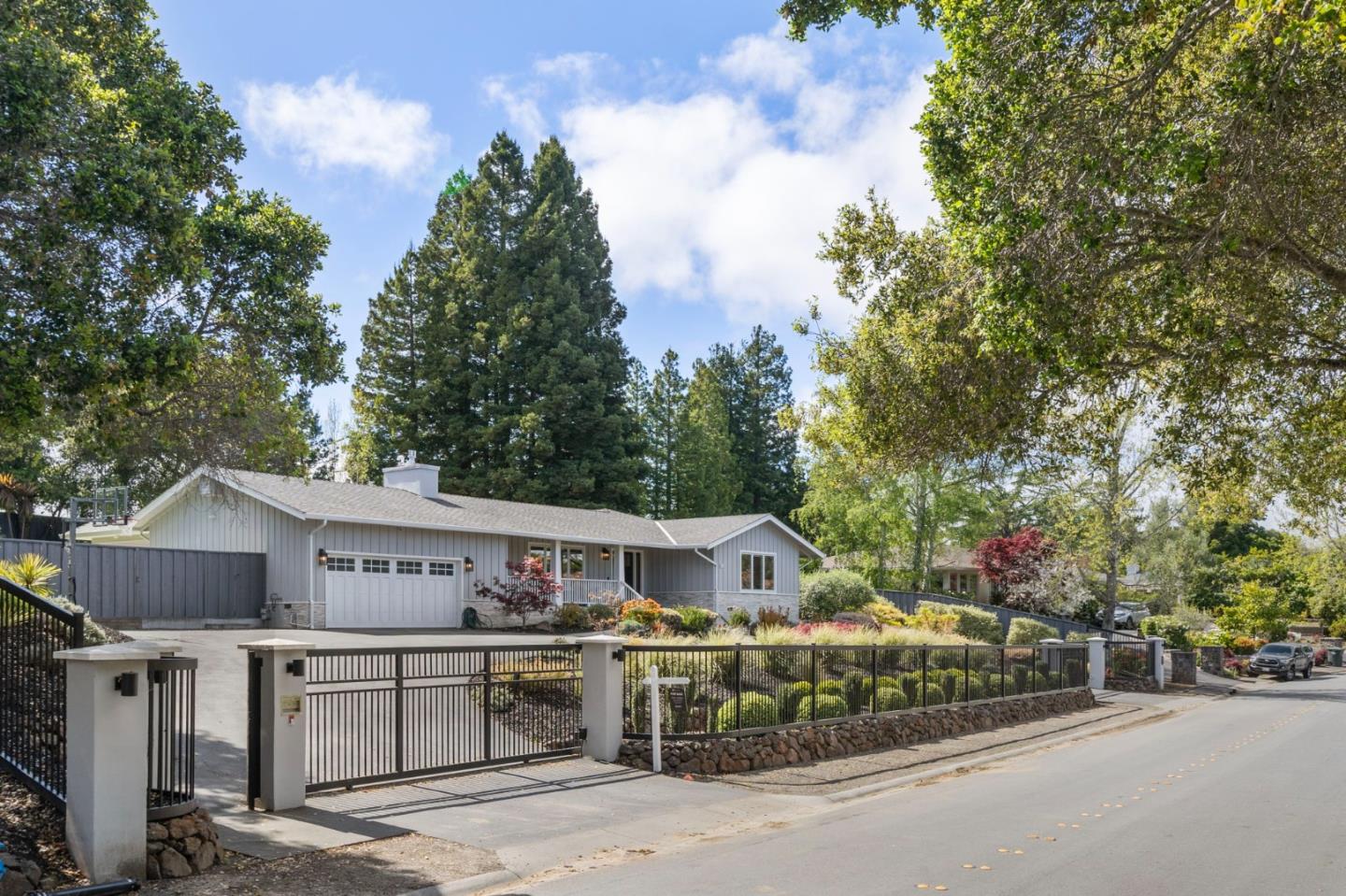 575 Darrell Road Hillsborough, CA 94010 - Photo 4 of 75 a view of a house with a wooden fence