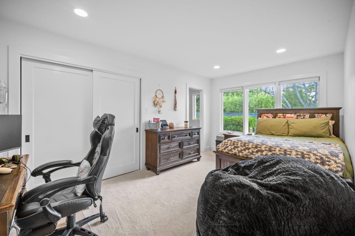 575 Darrell Road Hillsborough, CA 94010 - Photo 42 of 75 a bedroom with a bed a table and chair