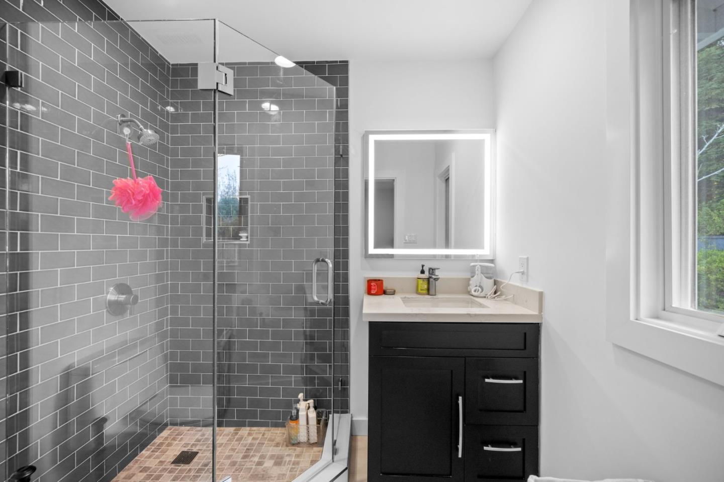 575 Darrell Road Hillsborough, CA 94010 - Photo 43 of 75 a bathroom with a sink shower and a mirror