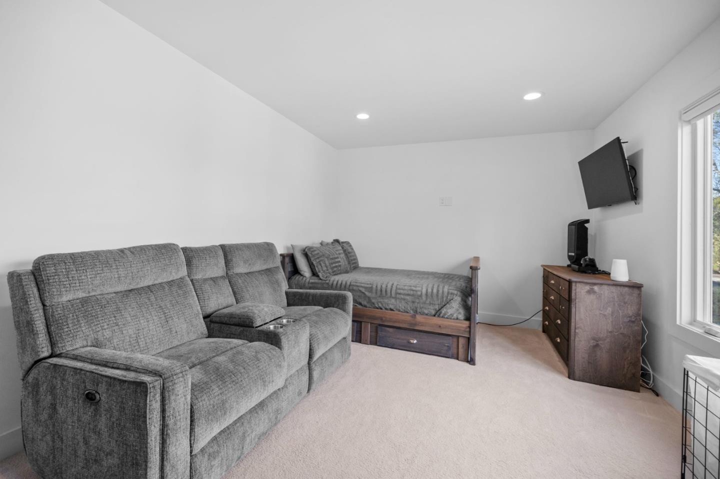 575 Darrell Road Hillsborough, CA 94010 - Photo 46 of 75 a living room with furniture and a flat screen tv