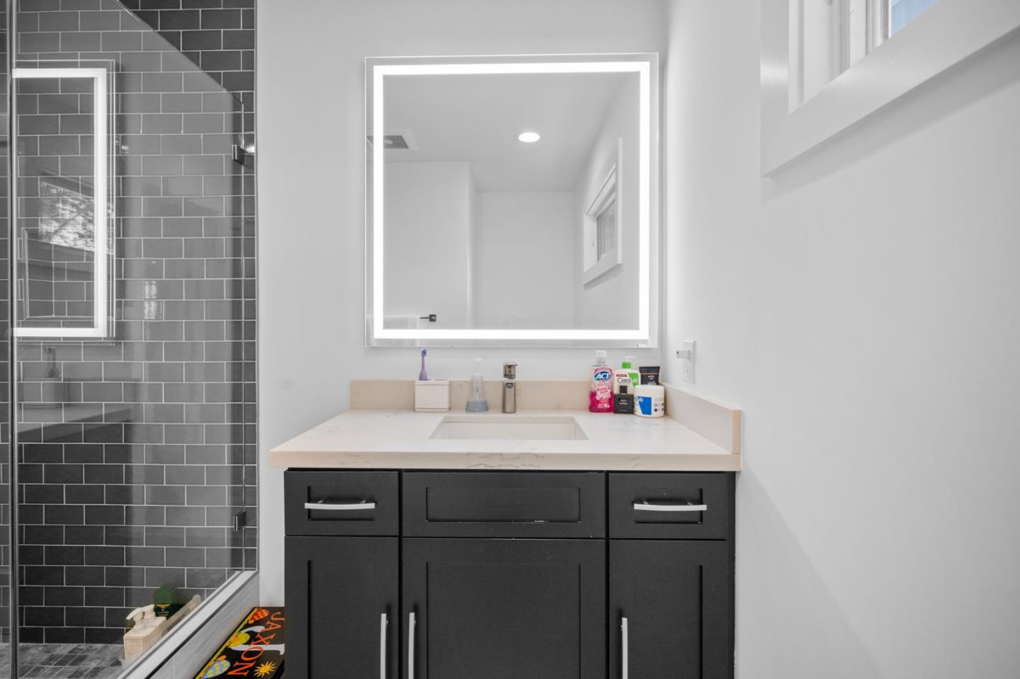 575 Darrell Road Hillsborough, CA 94010 - Photo 50 of 75 a bathroom with a sink vanity and a mirror