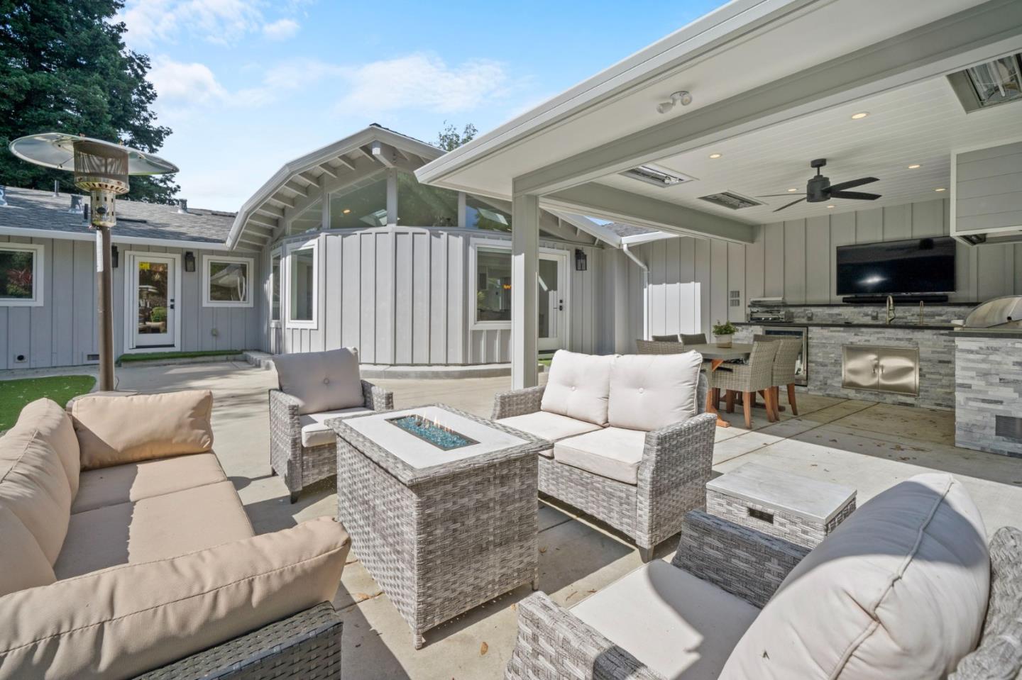575 Darrell Road Hillsborough, CA 94010 - Photo 57 of 75 a living room with furniture a flat screen tv and a fireplace