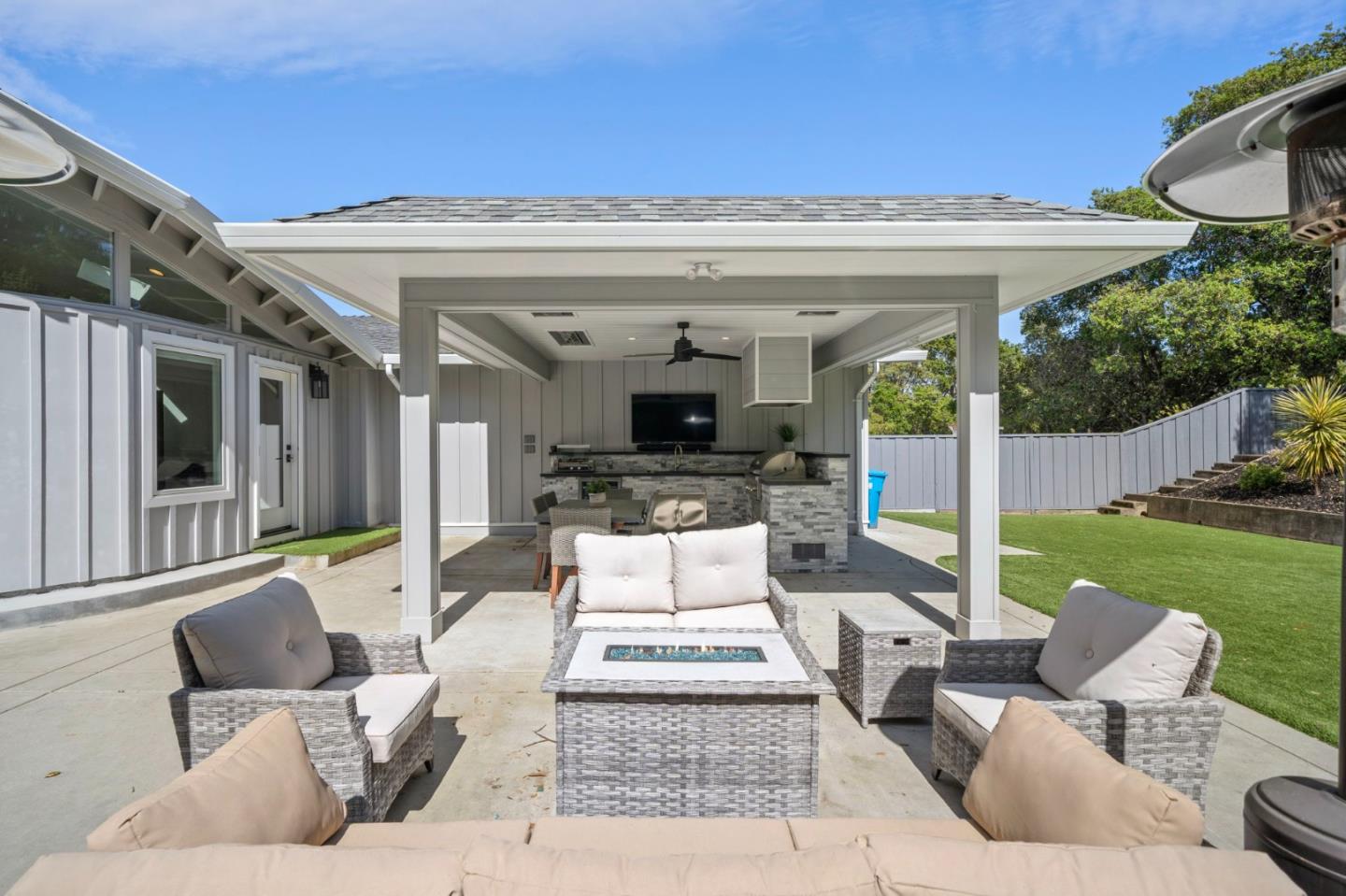 575 Darrell Road Hillsborough, CA 94010 - Photo 58 of 75 a view of a patio with couches table and chairs with garden view