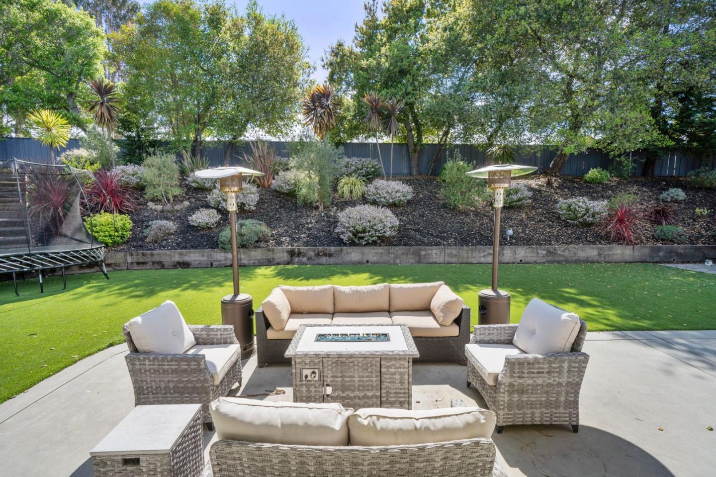 575 Darrell Road Hillsborough, CA 94010 - Photo 59 of 75 a view of a patio with couches chairs and a yard