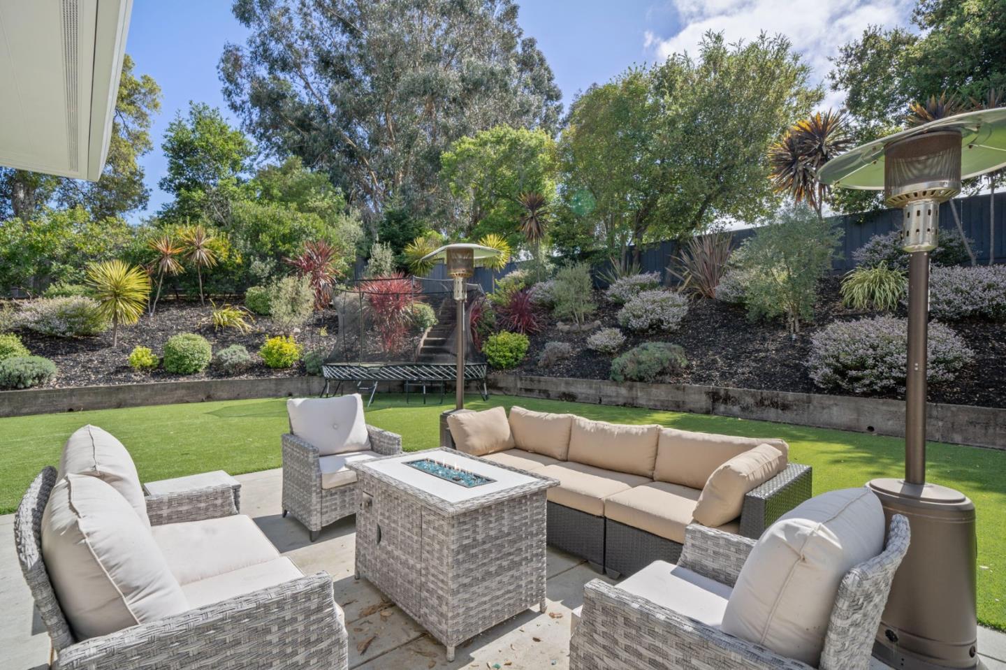 575 Darrell Road Hillsborough, CA 94010 - Photo 60 of 75 a view of a patio with couches chairs and a yard