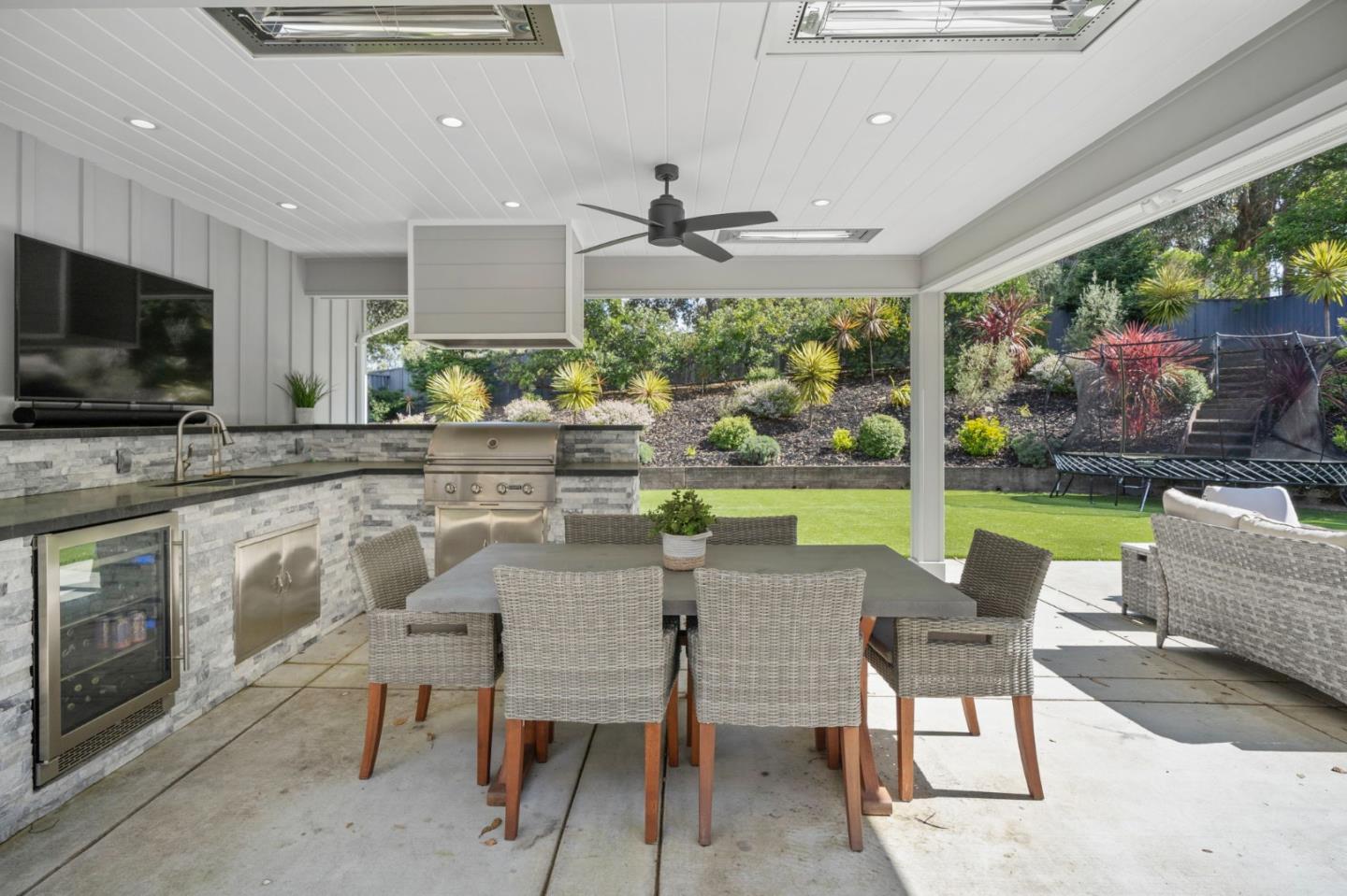 575 Darrell Road Hillsborough, CA 94010 - Photo 64 of 75 a dining room with furniture a window and a fireplace