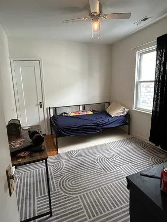 a kitchen that has a lot of cabinets in it and a window