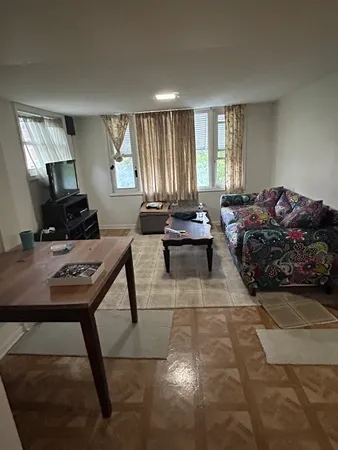 a bedroom with bed and window