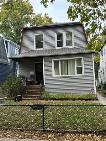 a view of a backyard with sitting area