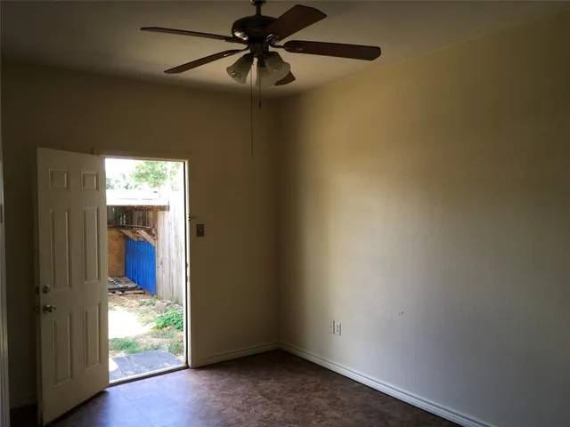 a view of hallway with wooden floor and chandelier