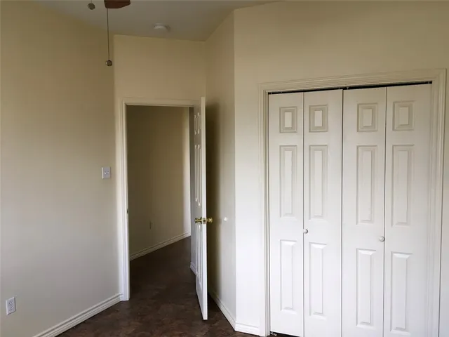 a view of a hallway with closet area