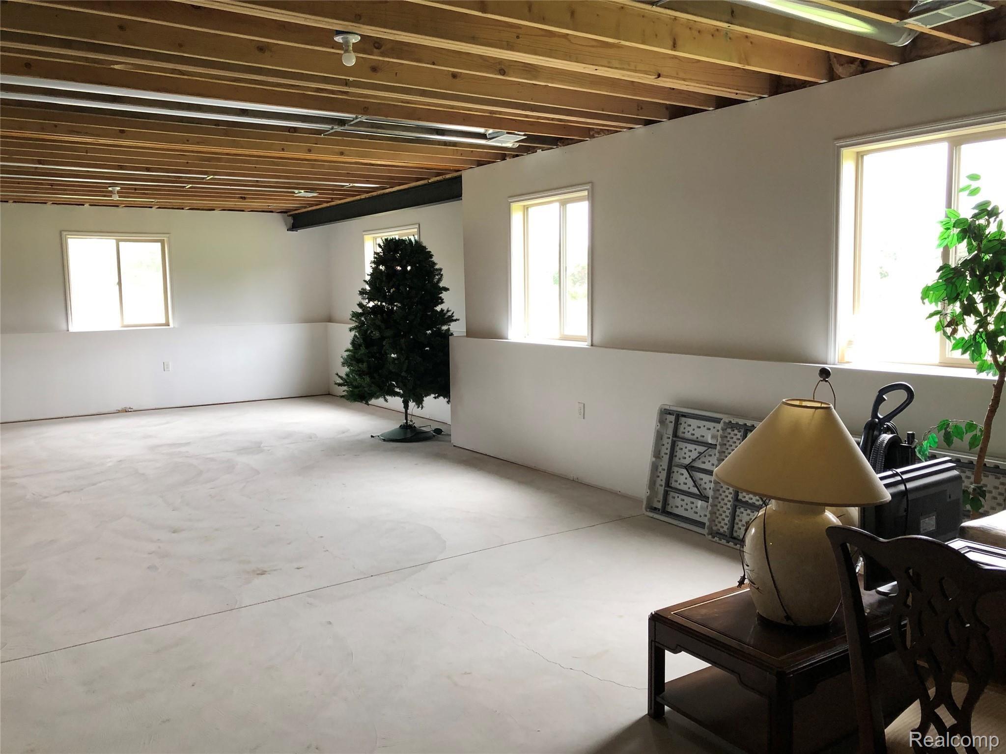 4960 Glover Road Almont, MI 48003 - Photo 31 of 35 Daylight basement is partially finished - drywalled and finished coat