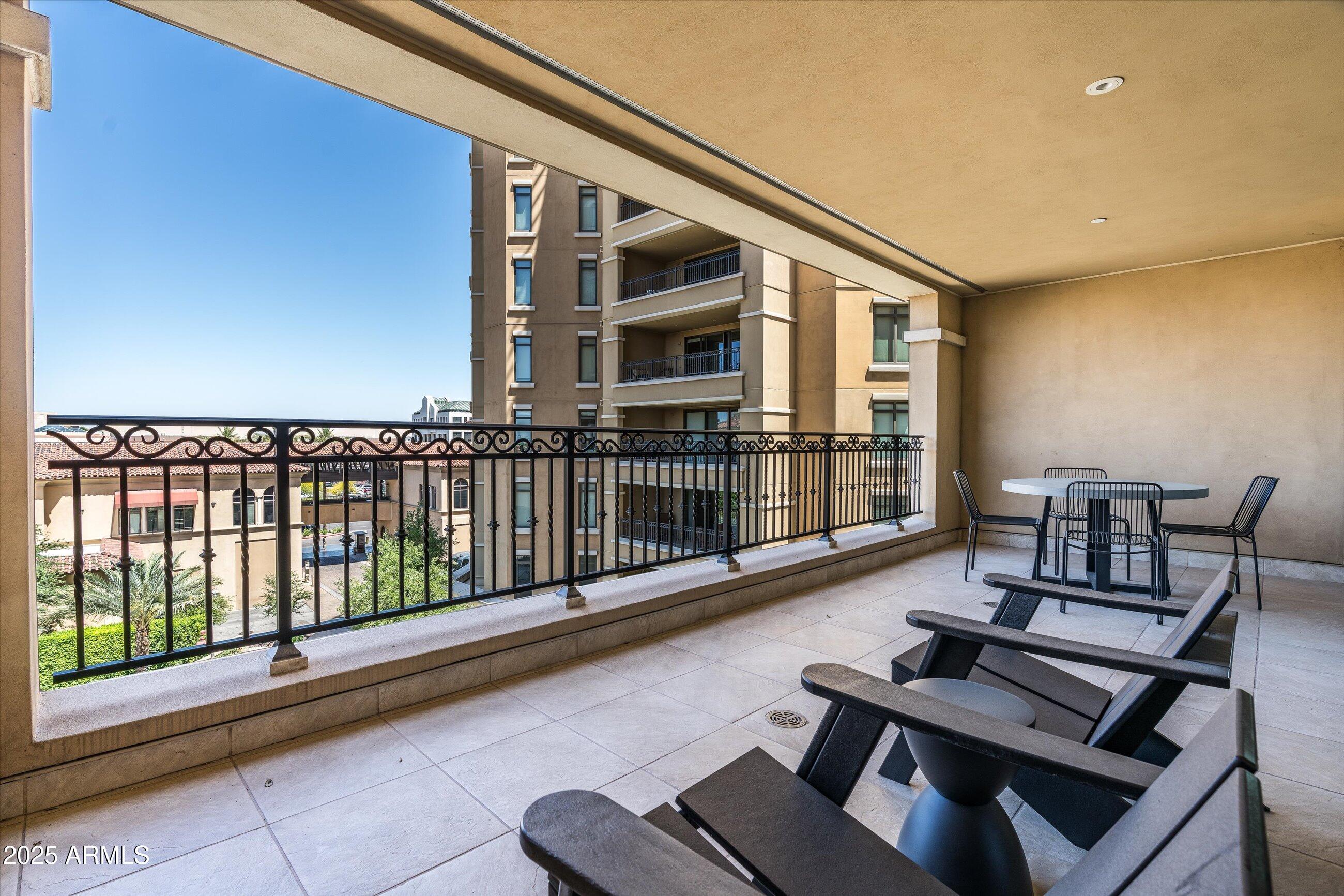 7175 East Camelback Road, Unit 510 Scottsdale, AZ 85251 - Photo 11 of 34 a view of a balcony with furniture