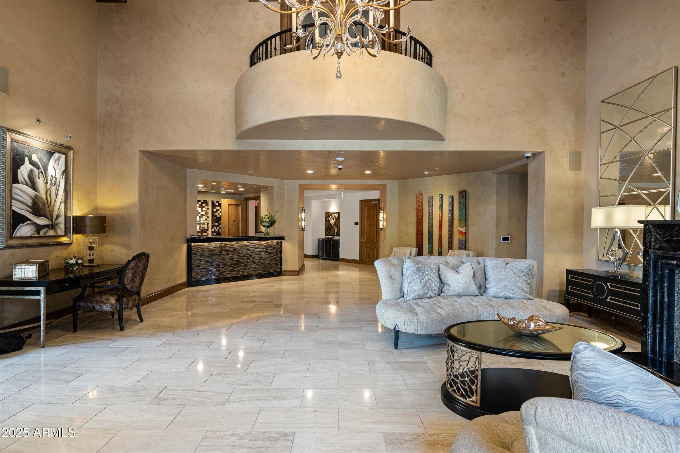 7175 East Camelback Road, Unit 510 Scottsdale, AZ 85251 - Photo 22 of 34 a living room with furniture and a fireplace