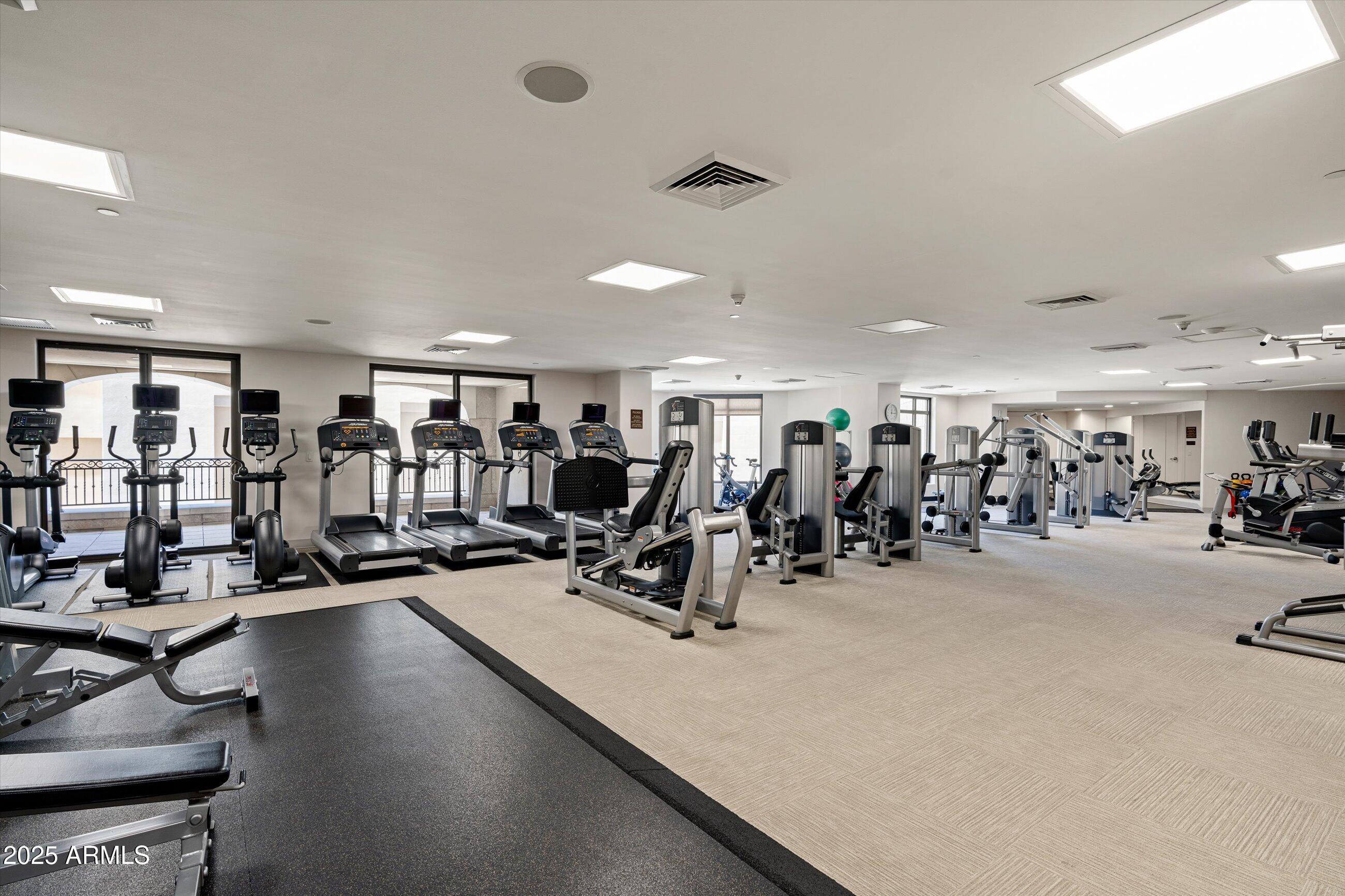 7175 East Camelback Road, Unit 510 Scottsdale, AZ 85251 - Photo 26 of 34 a view of a room with gym equipment