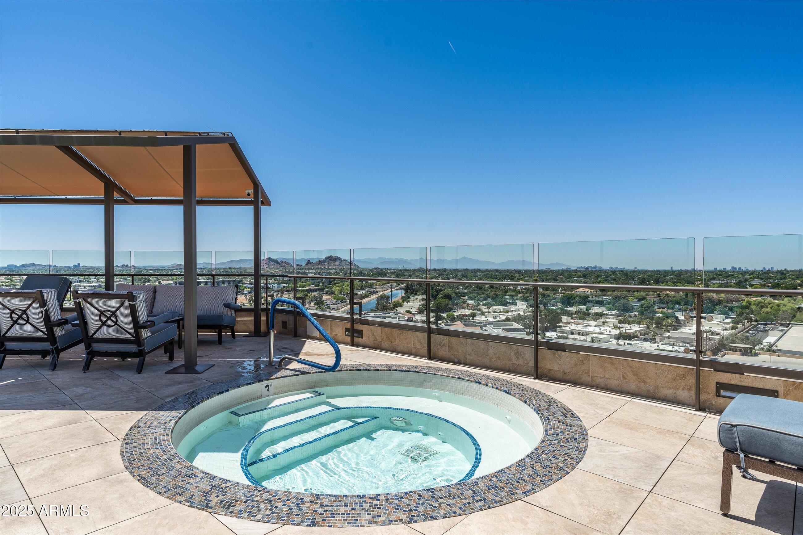 7175 East Camelback Road, Unit 510 Scottsdale, AZ 85251 - Photo 28 of 34 a view of a swimming pool with outdoor seating