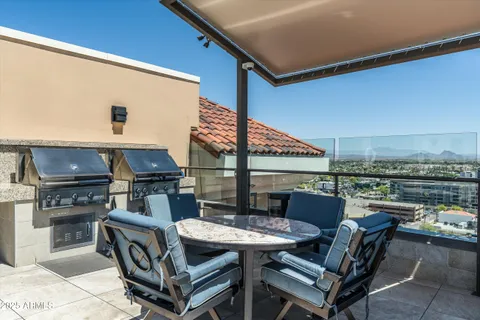 a terrace of a house with outdoor seating