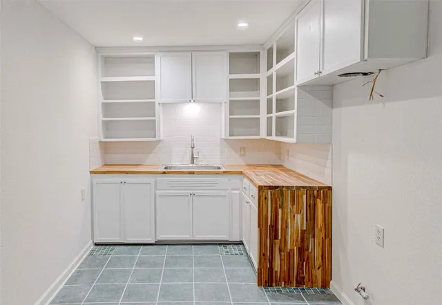 a view of a sink and cabinets