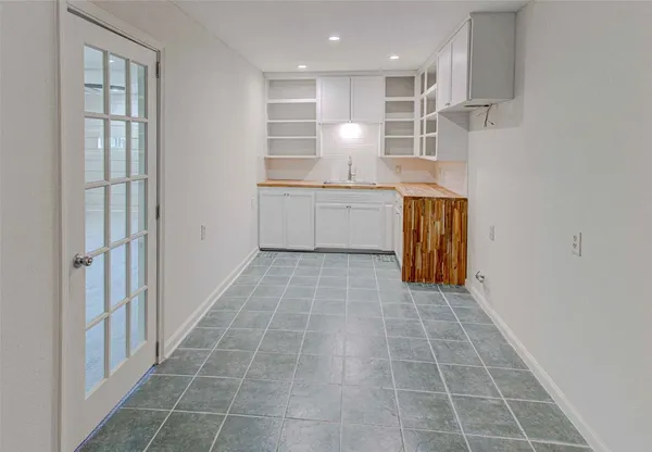 a kitchen with a sink cabinets and window