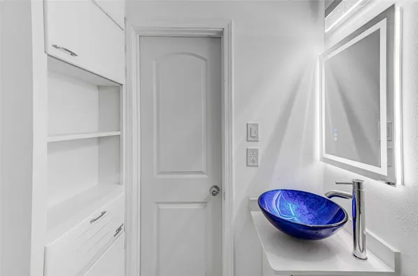 a view of a room with a wooden floor and a porch