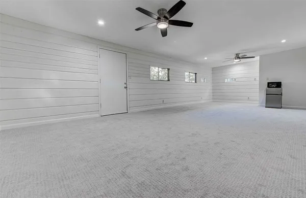 a white toilet sitting next to a bathroom sink