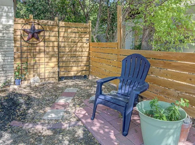 a view of a chairs in a backyard