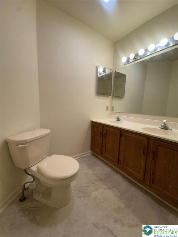 318 Mickley Road Whitehall, PA 18052 - Photo 18 of 25 a bathroom with a toilet sink and mirror