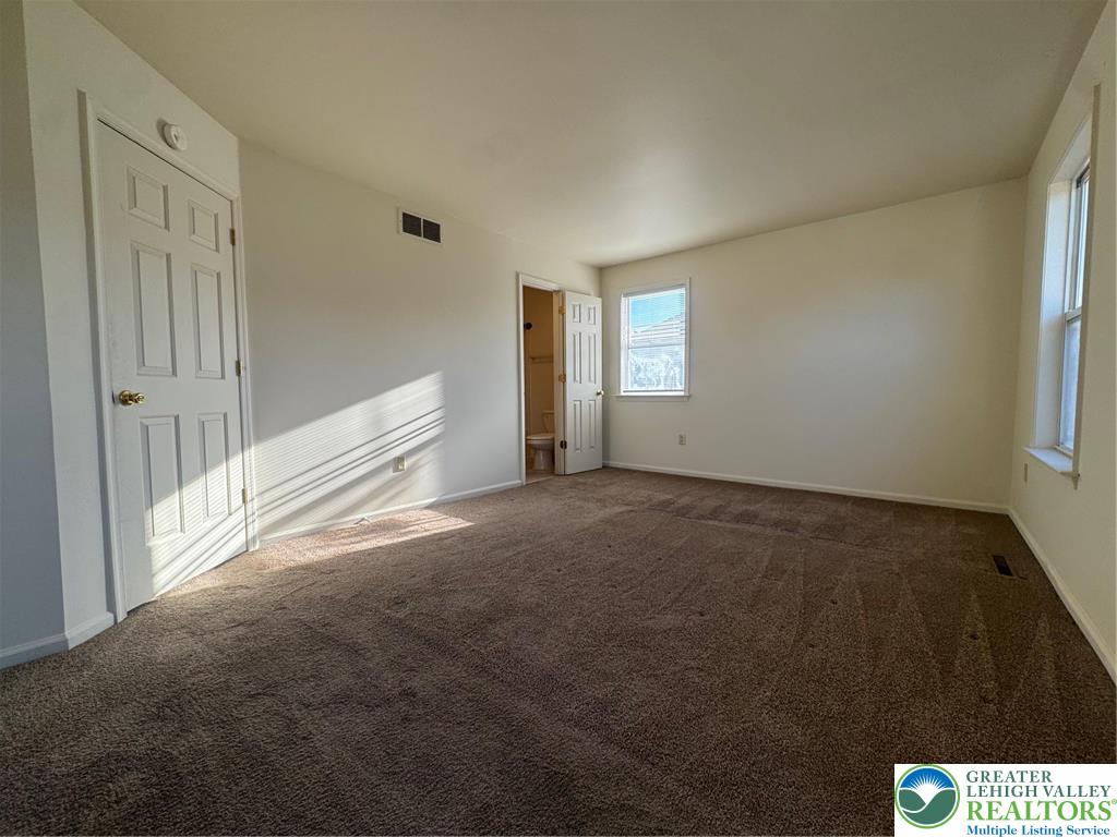 318 Mickley Road Whitehall, PA 18052 - Photo 8 of 25 a view of an empty room and window
