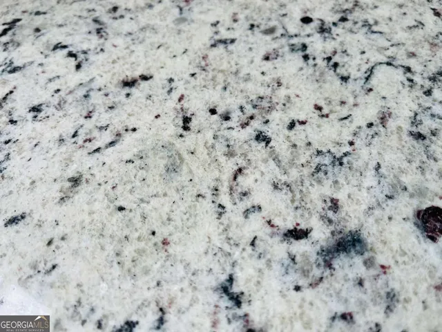 a close up of a white marble wall