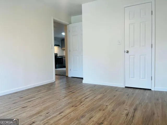 a view of a livingroom with wooden floor