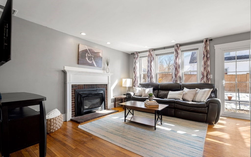 15 Lexington Terrace, Unit 1 Waltham, MA 02452 - Photo 12 of 13 a living room with furniture and a fireplace