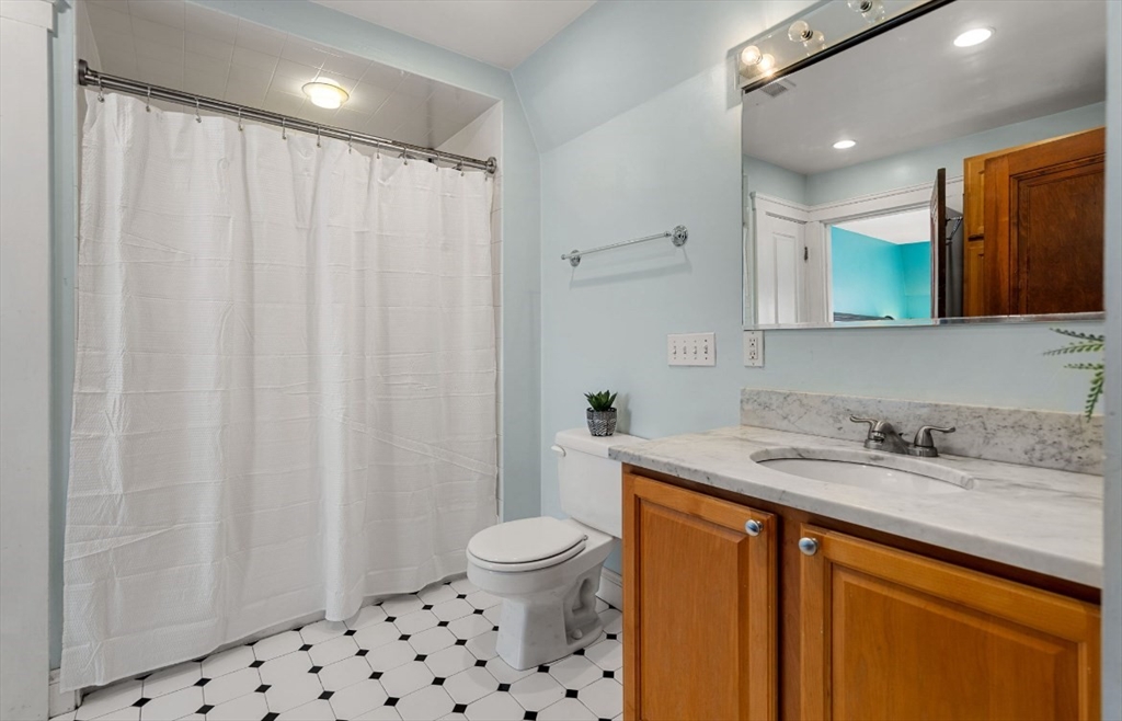 15 Lexington Terrace, Unit 1 Waltham, MA 02452 - Photo 5 of 13 a bathroom with a sink a toilet and shower