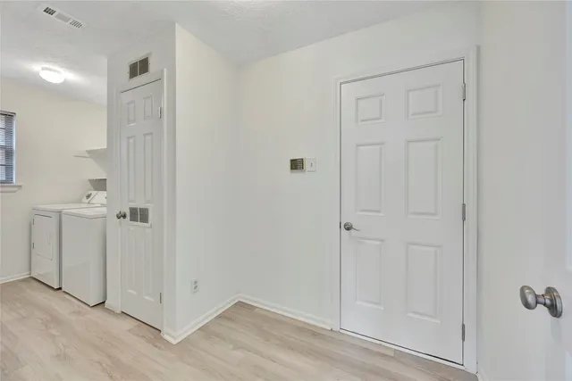 an empty room with closet area