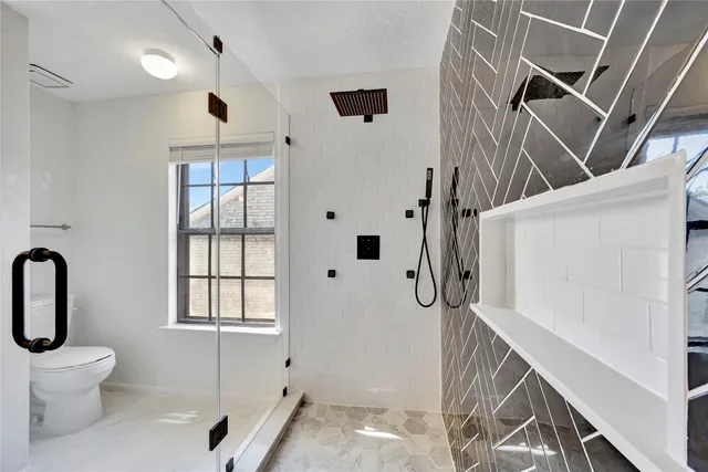 a bathroom with a bathtub and shower