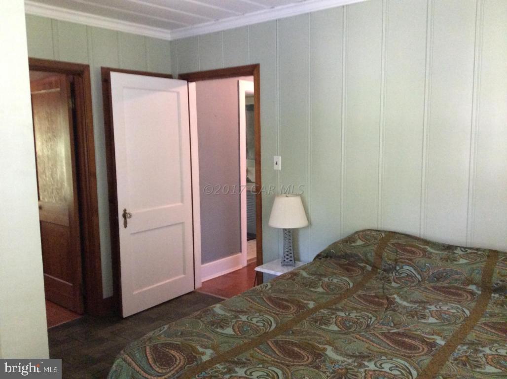 20502 Nanticoke Road Nanticoke, MD 21840 - Photo 21 of 27 a view of a room that has a bed in it