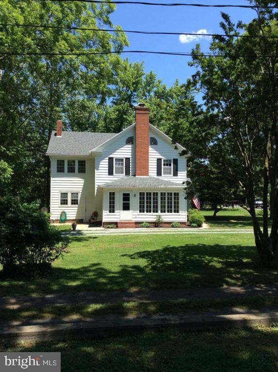 20502 Nanticoke Road Nanticoke, MD 21840 - Photo 25 of 27 a front view of a house with a garden