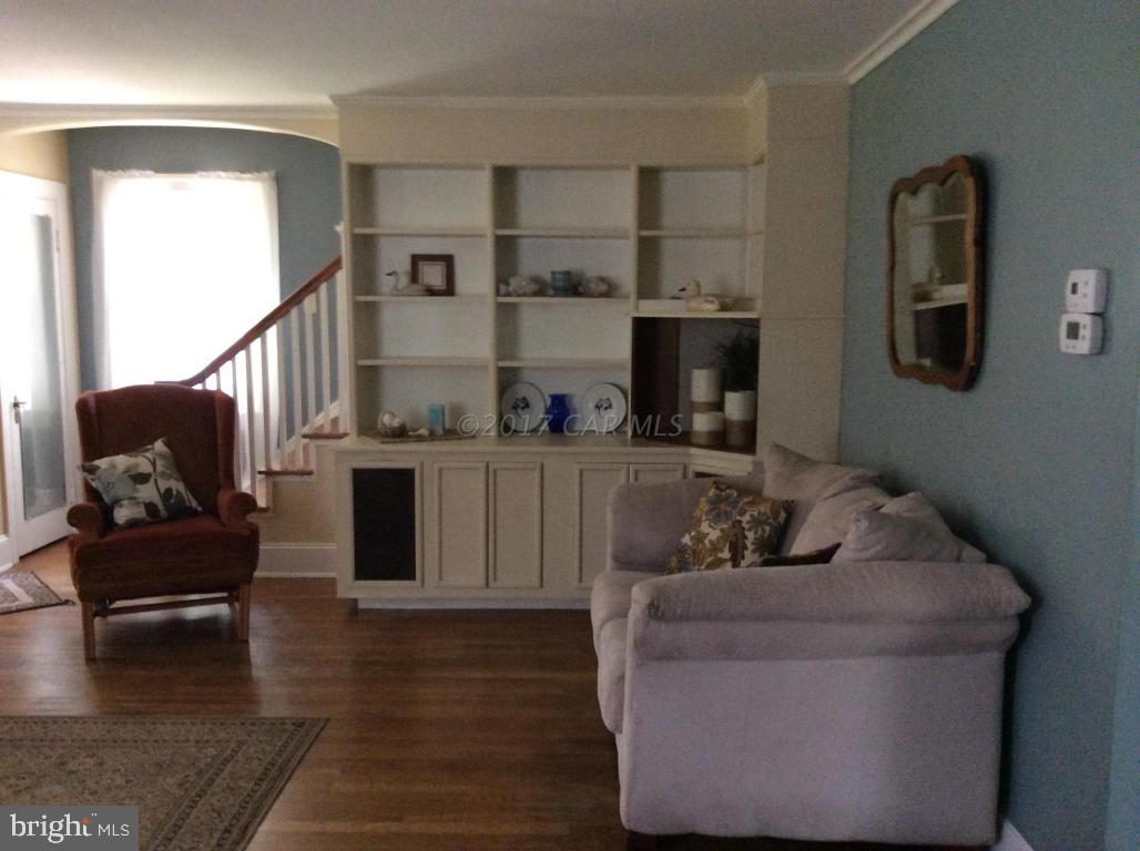 20502 Nanticoke Road Nanticoke, MD 21840 - Photo 10 of 27 a living room with furniture and a wooden floor