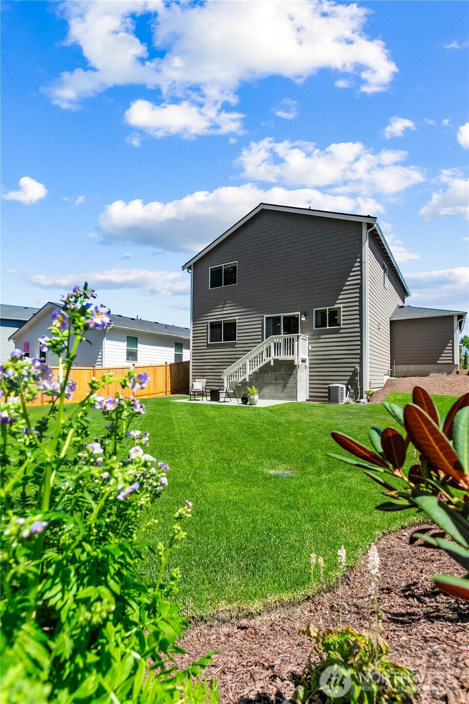 111 Northeast Ridgetop Crossing Belfair, WA 98528 - Photo 35 of 40 a front view of a house with garden