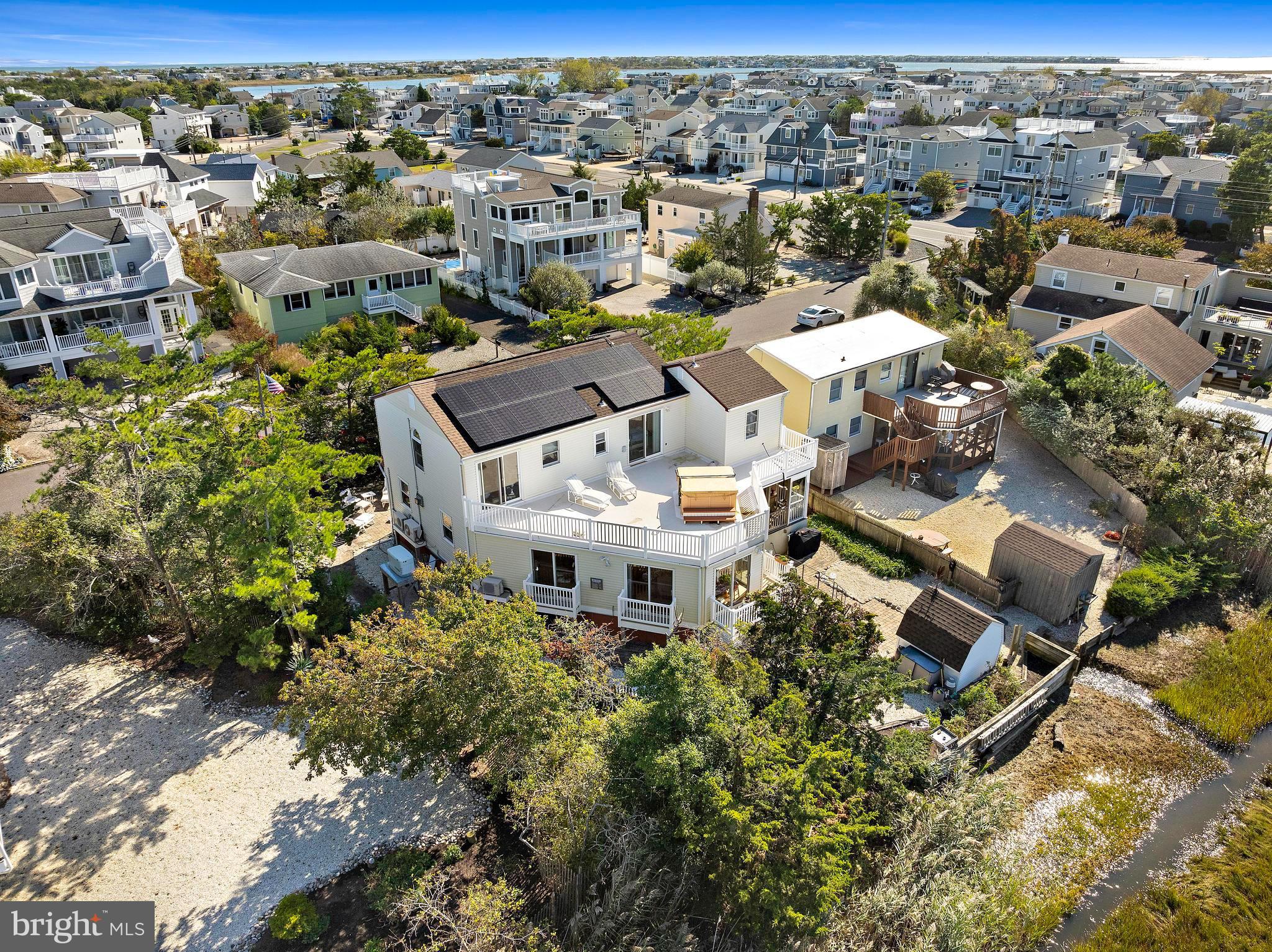 6 Collier Road Long Beach Township, NJ 08006 - Photo 14 of 24 an aerial view of a house with yard and outdoor space