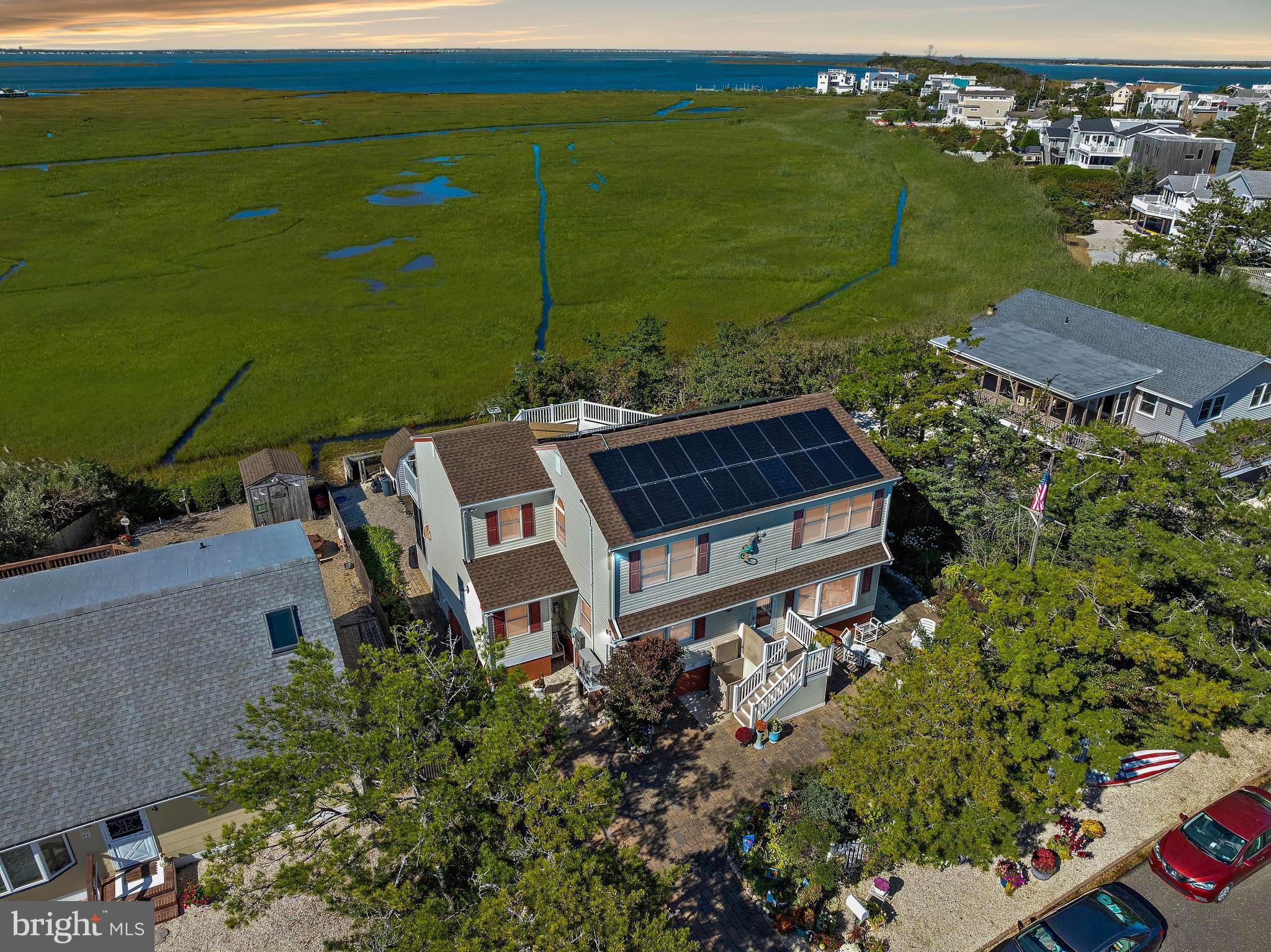 6 Collier Road Long Beach Township, NJ 08006 - Photo 15 of 24 an aerial view of a house with a lake view