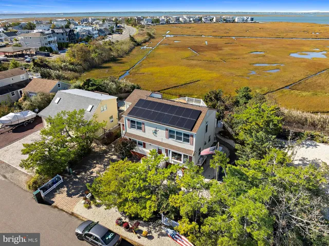 an aerial view of residential building and ocean