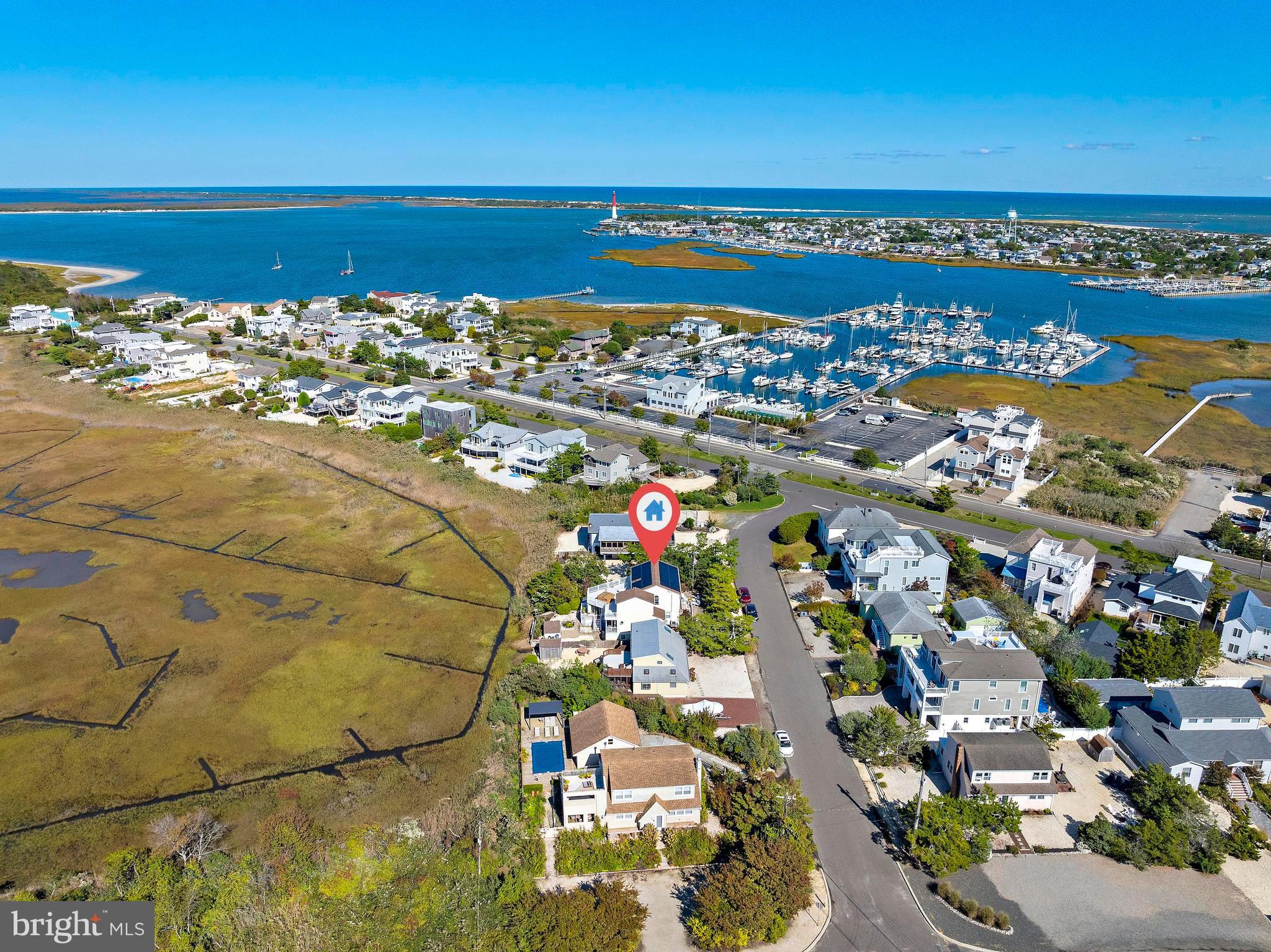 6 Collier Road Long Beach Township, NJ 08006 - Photo 19 of 24 a view of a city with an ocean