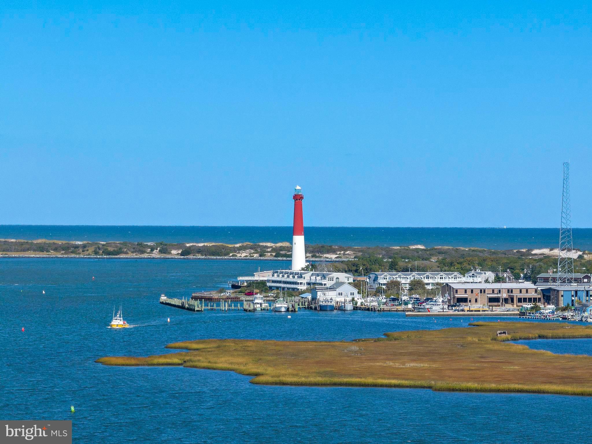 6 Collier Road Long Beach Township, NJ 08006 - Photo 21 of 24 a view of a city with an ocean