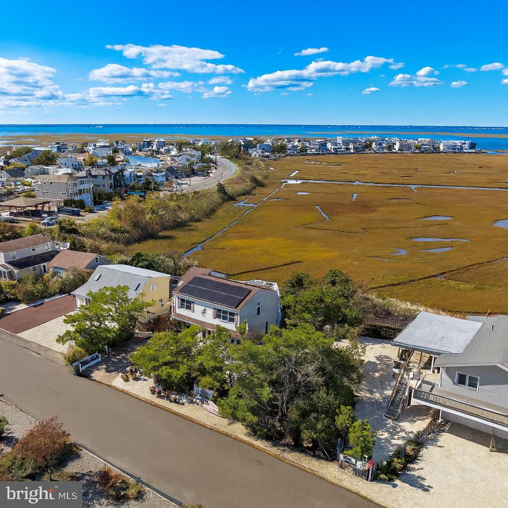 6 Collier Road Long Beach Township, NJ 08006 - Photo 4 of 24 a view of a city and an ocean view