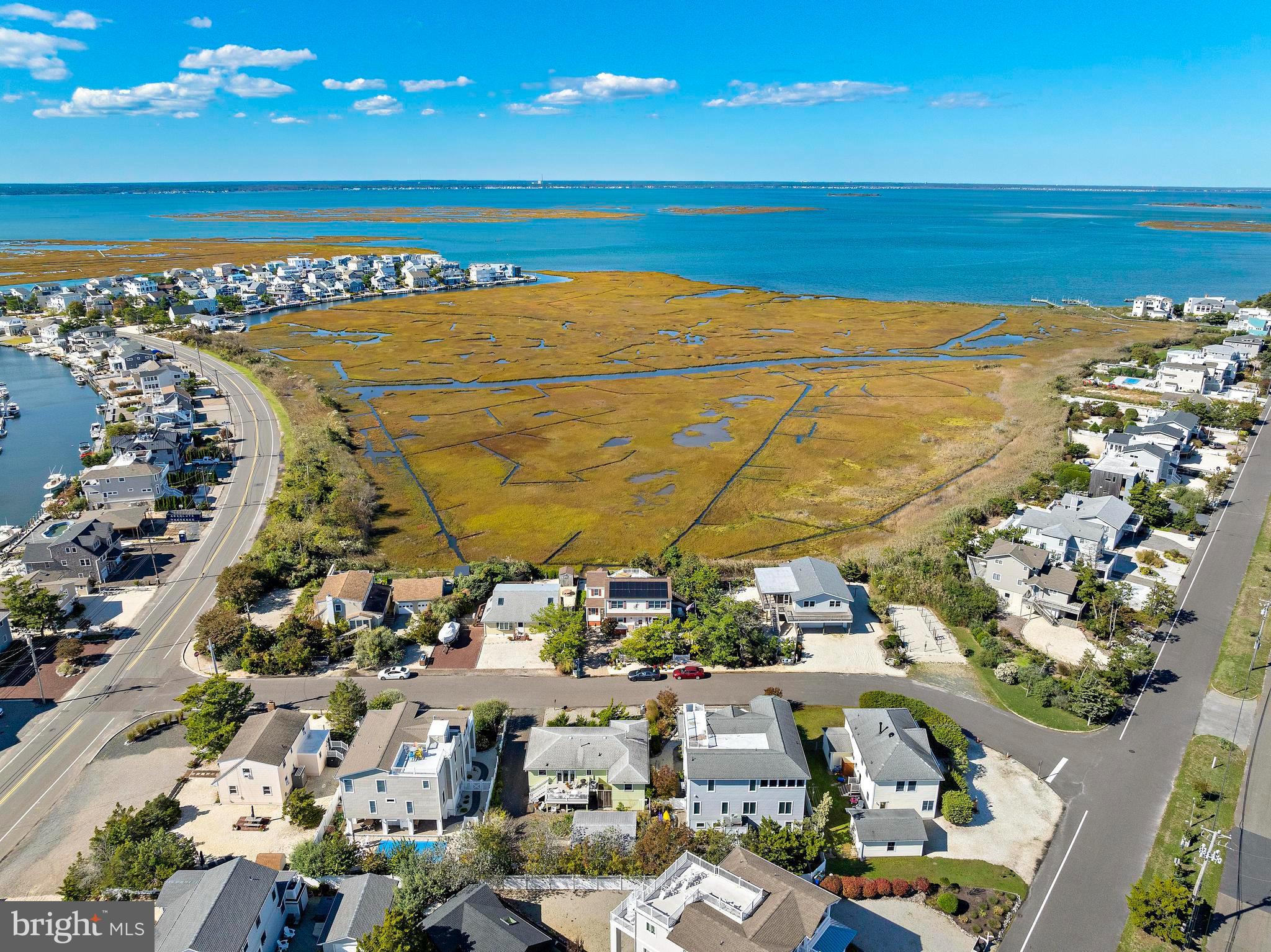 6 Collier Road Long Beach Township, NJ 08006 - Photo 5 of 24 a view of an ocean and a building