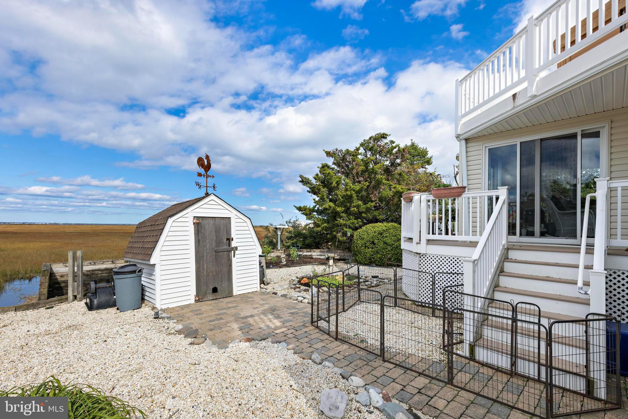 6 Collier Road Long Beach Township, NJ 08006 - Photo 9 of 24 a view of a chair and tables in the patio