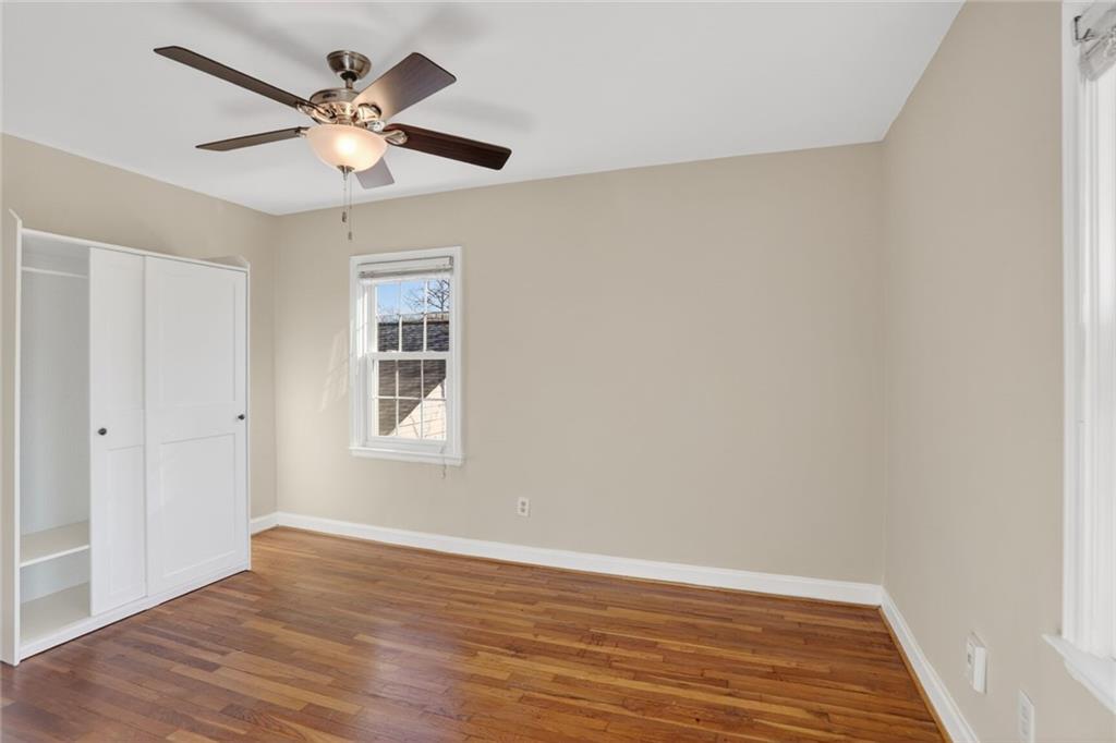 578 Goldsboro Road Northeast, Unit D Atlanta, GA 30307 - Photo 14 of 20 wooden floor in an empty room with a window